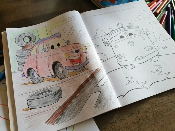 Coloring book of children with drawing of a car.